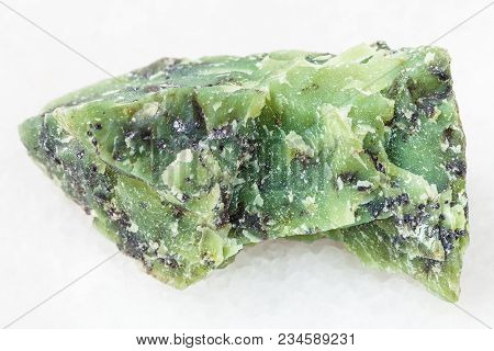Macro Shooting Of Natural Mineral Rock Specimen - Raw Lizardite Stone On White Marble Background Fro