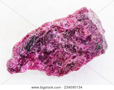 Macro Shooting Of Natural Mineral Rock Specimen - Raw Eudialyte Stone On White Marble Background Fro