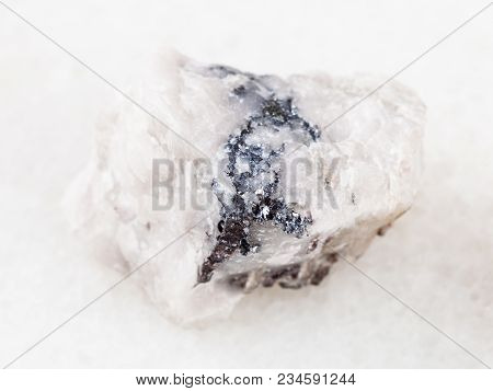 Macro Shooting Of Natural Mineral Rock Specimen - Rough Wolframite Ore On White Marble Background Fr