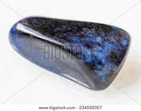 Macro Shooting Of Natural Mineral Rock Specimen - Polished Dumortierite Gem On White Marble Backgrou