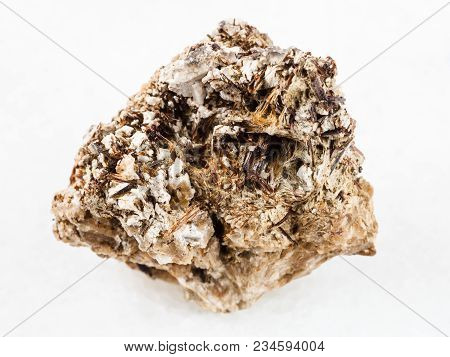 Macro Shooting Of Natural Mineral Rock Specimen - Brown Astrophyllite Crystals In Rough Natrolite St