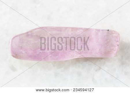 Macro Shooting Of Natural Mineral Rock Specimen - Polished Kunzite Gemstone On White Marble Backgrou