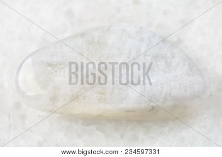 Macro Shooting Of Natural Mineral Rock Specimen - White Moonstone (adularia) Gemstone On White Marbl