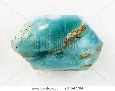 Macro Shooting Of Natural Mineral Rock Specimen - Rough Crystal Of Blue Apatite Gemstone On White Ma