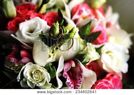 Wedding Rings In A Wedding Bouquet In The Sun. Wedding Accessories. Summer Day. Rings Of The Groom A