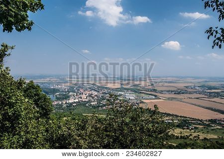 Lovosice City With Agricultural Landscapea Round With Fields, Villages, Roads And Small Hills On The