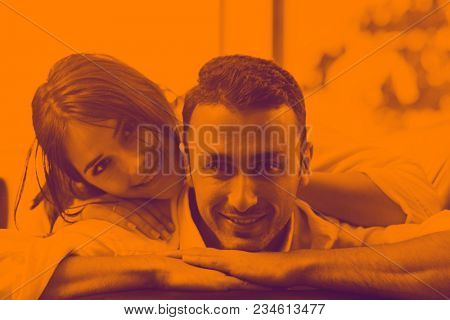 happy young family relax and have fun at modern home indooor duo tone
