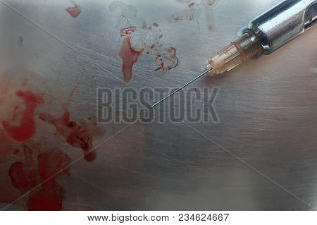 Injection Needle On A Stainless Steel Tray,have Bloody