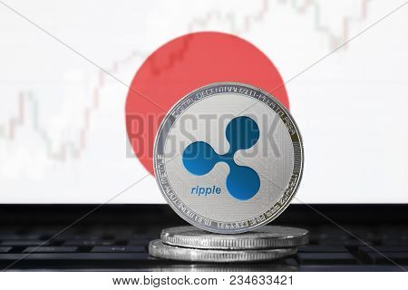 Ripple (xrp) Cryptocurrency; Physical Concept Ripple Coin On The Background Of The Flag Of Japan