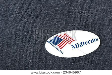 Closeup Of A Sticker With An American Flag And The Word 