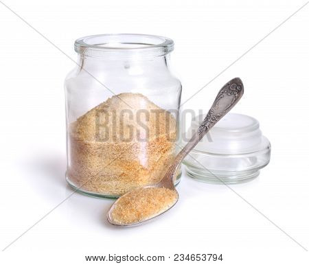 Gelatin Or Gelatine In The Glass Jar. On White Background.