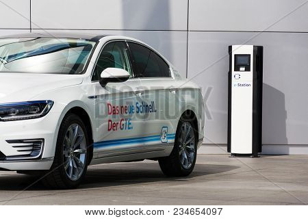 Dresden, Germany - April 2 2018: Plug-in Hybrid Electric Car Volkswagen Golf Gte Stands By Charging 