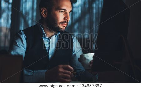 Bearded Young Businessman Working On Modern Office. Consultant Man Thinking Looking In Monitor Compu