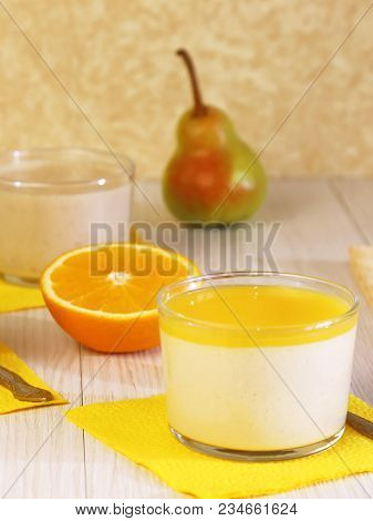 Food. Panna Cotta. Milk Fruit Dessert Made Of Yoghurt And Cream With Pear And Orange.