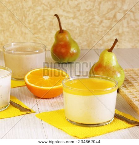 Food. Panna Cotta. Milk Fruit Dessert Made Of Yoghurt And Cream With Pear And Orange.