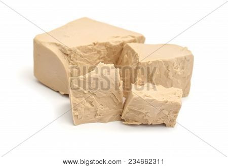 A Block Of Compressed Fresh Yeast Isolated.