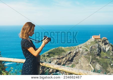 Tourist Traveler Photographer Making Pictures Sea Scape On Photo Camera On Background Ocean Gaztelug