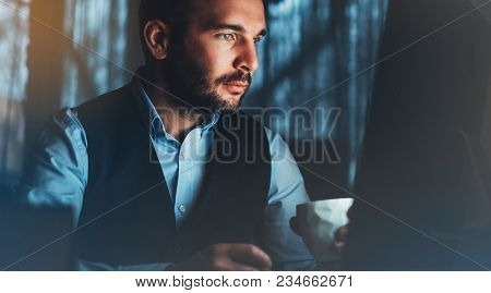Bearded Young Businessman Working On Modern Office. Consultant Man Thinking Looking In Monitor Compu