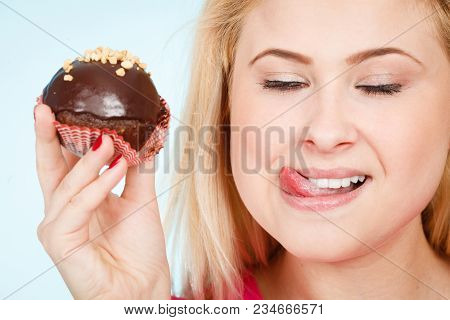 Diet, Sweets, Food Concept. Woman Holding Delicious Chocolate Cupcake With Peanut Frosting About To 