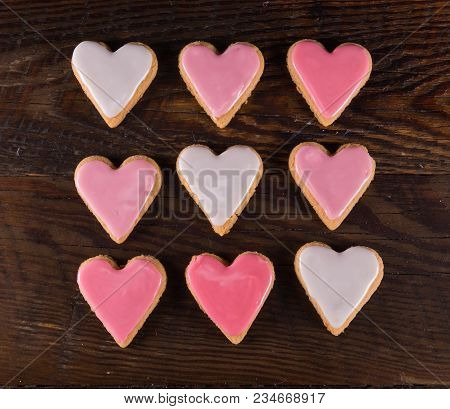Nine Frosted  Heart Cookies In Grid With Gradients Of Pink Icing