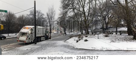 Bronx, New York - March 7: Wide View Of Macombs Park And Sanitation Truck During Snow Storm.  Taken 