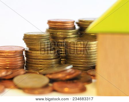 Saving Concept - Close Up Small Blocks House With Coins, Saving Money For A House