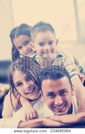 happy young family relax and have fun at modern home indooor