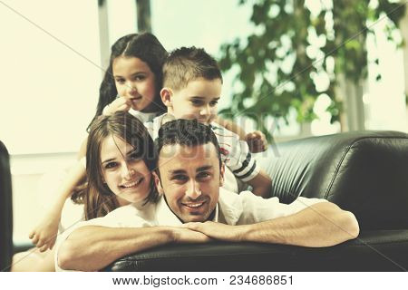 happy young family relax and have fun at modern home indooor