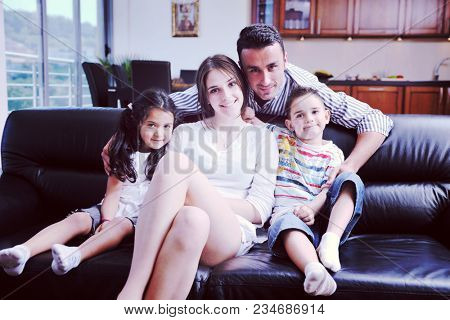 happy young family relax and have fun at modern home indooor