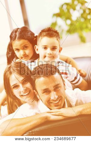 happy young family relax and have fun at modern home indooor