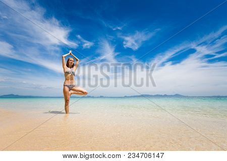 Tropical Summer Yoga Session On Beautiful Sunset Beach, Koh Kradan Island In Thailand. Vriksha Asana