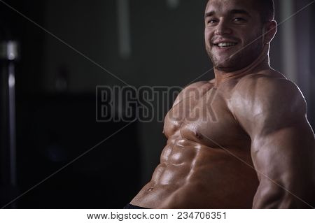 Brutal Strong Bodybuilder Athletic Men Pumping Up Muscles With Dumbbells