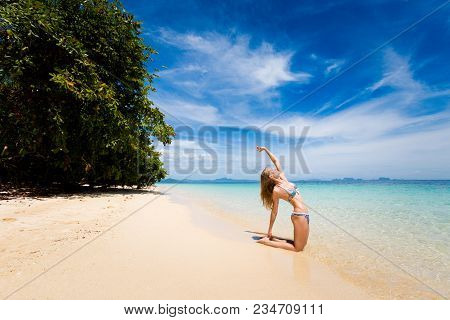 Tropical Summer Yoga Session On Beautiful Sunset Beach, Koh Kradan Island In Thailand. Vriksha Asana