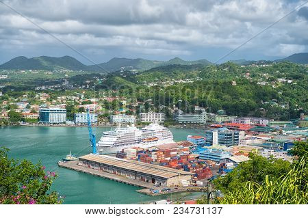 Castries, St.lucia - November 26, 2015: Ocean Liner In Sea Port On Mountain Landscape. Town On Blue 