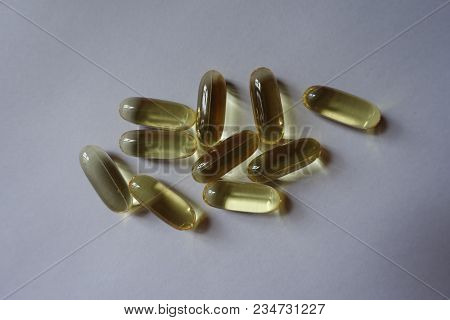 Somewhat Long Yellow Softgel Capsules Of Fish Oil