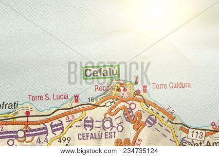 Cefalu. The Island Of Sicily, Italy. A Paper Map And Roads On The Map.