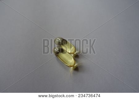 2 Big Yellow Softgel Capsules Of Fish Oil