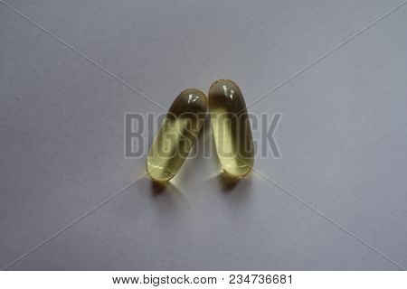 Macro Of Two Capsules Of Fish Oil