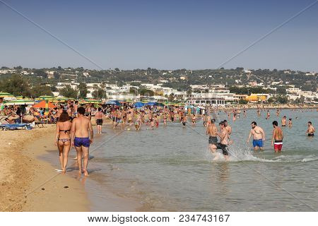 Salento, Italy - June 2, 2017: People Visit Maldives Di Pescoluse Beach In Salento Peninsula, Italy.