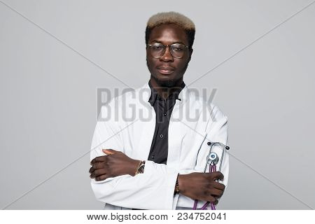 Portrait Of Handsome Afro American Doctor With Sthethoscope In White Coat Looking At Camera, Isolate