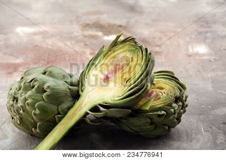 Artichokes On Grey Background. Fresh Organic Artichoke Flower.