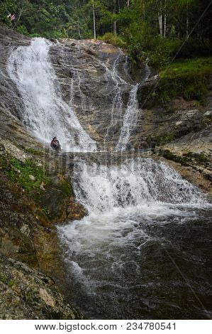 Lata Iskandar, Perak, Malaysia. March 25, 2018. A Lady Taking A Rest At A Lata Iskandar Waterfall, L