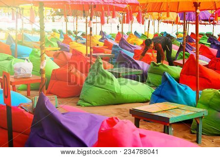 Indonesia, Bali Island, Beach In Kuta - October 01, 2017: Сafe Worker Is Preparing To Open A Restaur