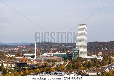Basel, Switzerland - October 20, 2016: Skyline View With The Roche Tower At The Headquarters Of The 