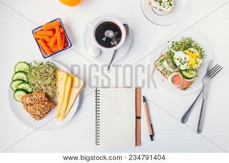 Top View Planning Notebook With Copy Space And Healthy Breakfast. Sandwich With Egg Benedict And Smo
