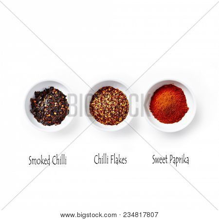 Organic Paprica Powder, Chilli Flakes and Smoked Chilli Flakes on White Background