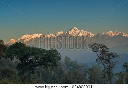 Beautiful View Of Kanchenjunga Mountain Range With First Daylight On It, At The Background, Moring L