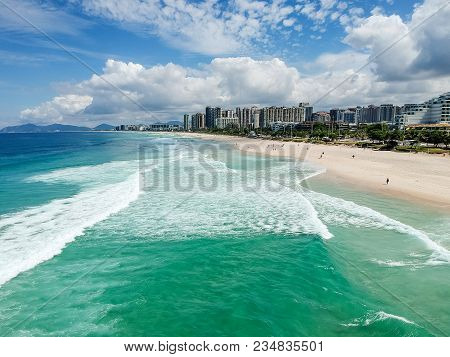 Drone Photo Of Barra Da Tijuca Beach, Rio De Janeiro, Brazil. We Can See The Beach, Some Building, T