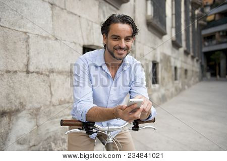 Young Happy Attractive Hispanic Man In Casual Trendy Clothes Smiling Cheerful Using Mobile Phone On 