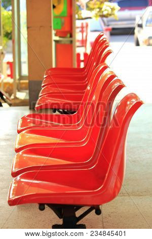Chair Made Of Plastic Orange On The Floor.
